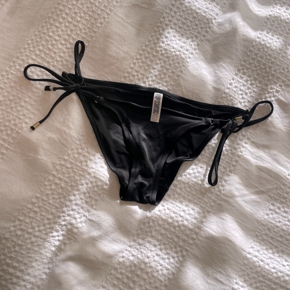 Black Victoria’s Secret bikini bottoms